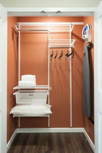 a walk in closet with a shower and towels at TownePlace Suites by Marriott Charleston Airport/Convention Center in Charleston