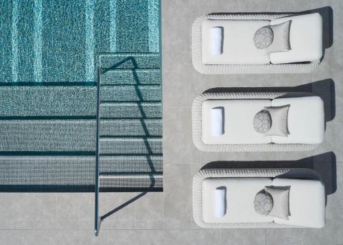 an aerial view of two beds with pillows at Hotel X Brisbane Fortitude Vly, Vignette Collection by IHG in Brisbane
