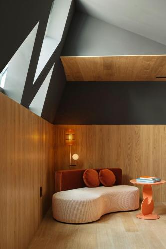 a room with a bed and a table on the floor at W Budapest in Budapest