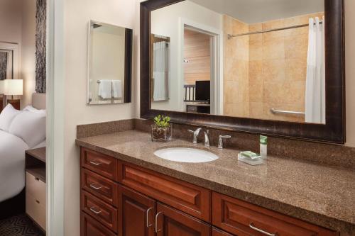 a bathroom with a sink and a large mirror at Marriott's StreamSide Douglas at Vail in Vail