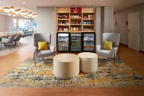 a lobby with two chairs and a coffee table at TownePlace Suites Winchester in Winchester