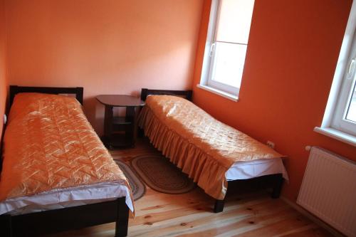 En eller flere senge i et værelse på Troyanda