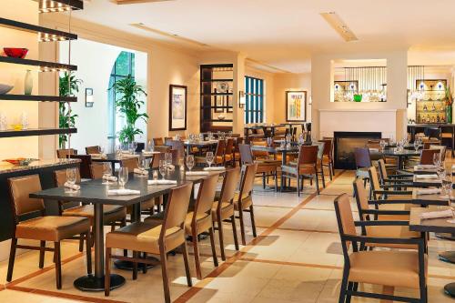 a dining room with tables and chairs at Sheraton Hotel Stonebriar in The Colony