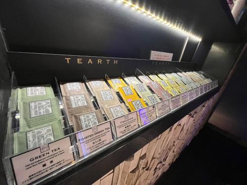a display case with several boxes of tea packets at Fun3 -Adult Only- in Yokohama