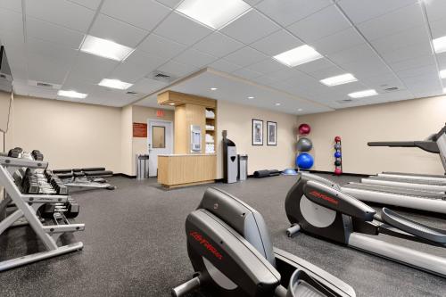 a gym with treadmills and chairs in a room at TownePlace Suites by Marriott Charleston Mt. Pleasant in Charleston