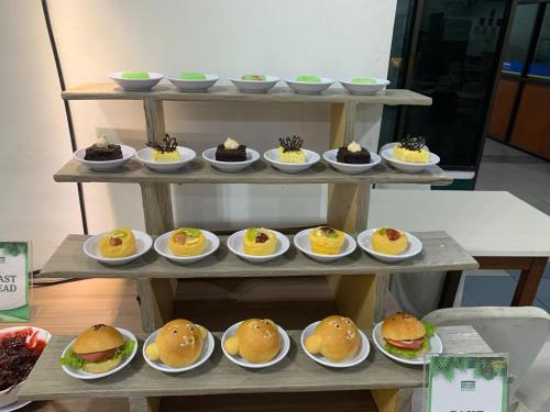 a display of food on plates on a table at Graha Widya Bhakti at STIESIA Surabaya in Surabaya