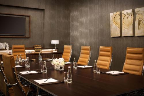 a conference room with a long table and chairs at Sheraton Baku Intourist in Baku