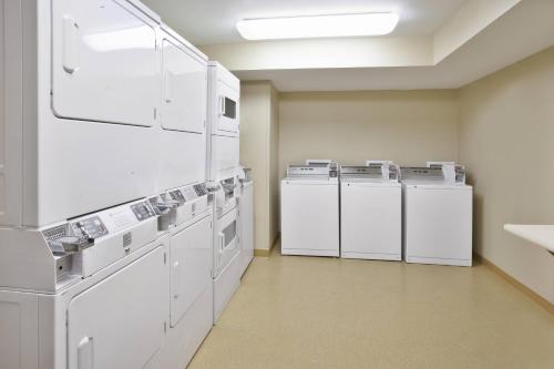 a row of washers and dryers in a room at TownePlace Suites Minneapolis-St. Paul Airport/Eagan in Eagan