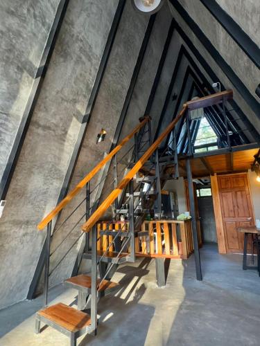 an image of a staircase in a building at Chalet de los ciervos in Isla Cabuya