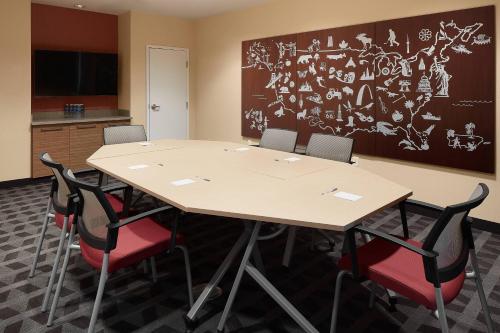a conference room with a table and four chairs at TownePlace Suites by Marriott Danville in Danville