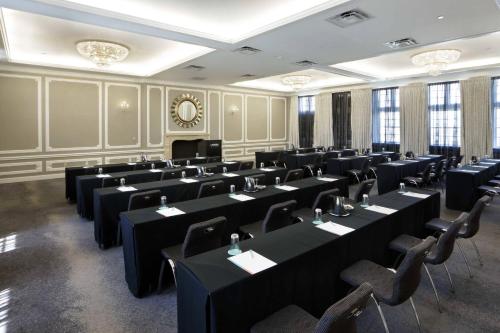 a large room with tables and chairs in it at Le Meridien Dallas, The Stoneleigh in Dallas