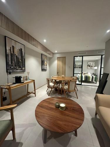 a living room with a table and a couch at Apartment with city views central area in Guadalajara