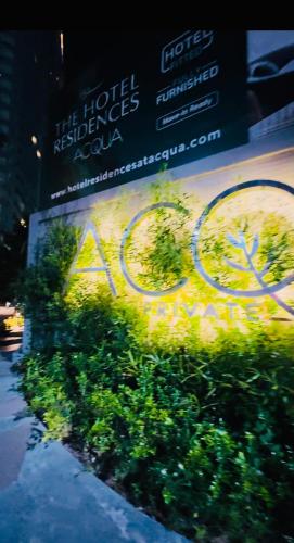 a sign for a hotel with a bike on it at Hotel Residences at ACQUA Tower near Rockwell Makati in Manila