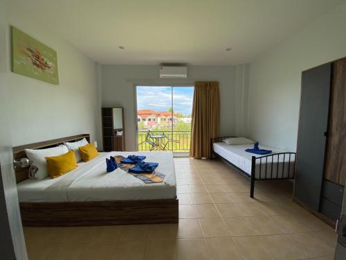 Postel nebo postele na pokoji v ubytování L&P Guesthouse