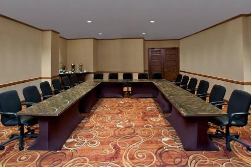 a large conference room with a long table and chairs at Sheraton Minneapolis West Hotel in Minnetonka