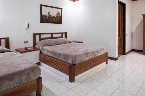 Un pat sau paturi într-o cameră la Go Resort