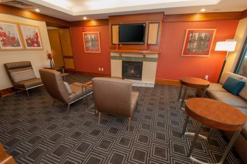 a living room with a couch and a fireplace at TownePlace Suites by Marriott Scranton Wilkes-Barre in Moosic