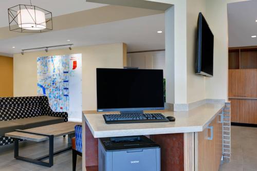 a computer monitor on a desk in a room at TownePlace Suites by Marriott Indianapolis Downtown in Indianapolis