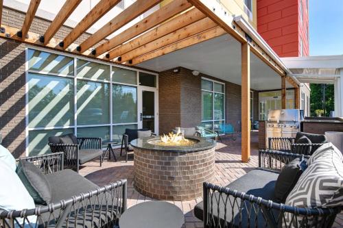 an outdoor patio with chairs and a fire pit at TownePlace Suites by Marriott Sumter in Sumter