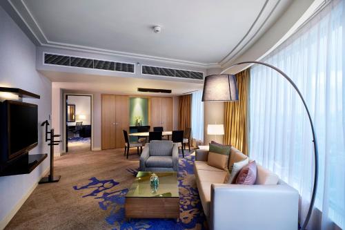 a living room with a couch and a table at The Westin Kuala Lumpur in Kuala Lumpur