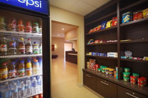 a store filled with lots of bottles of soda at Residence Inn by Marriott Austin The Domain Area in Austin