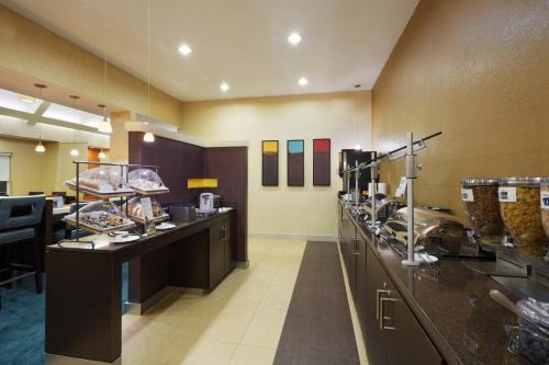 a restaurant with a buffet line with food at Residence Inn by Marriott Austin The Domain Area in Austin