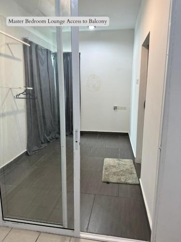 a hallway with a glass door in a room at 5 Bedroom House Near Sunway Lagoon in Petaling Jaya
