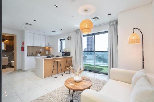 a living room with a white couch and a table at SuCasa in Dubai