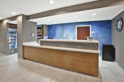 a lobby of a library with a reception counter at SpringHill Suites Minneapolis-St. Paul Airport/Eagan in Eagan