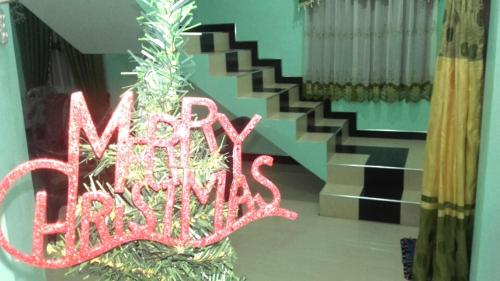 a sign that says new entries on a christmas tree at veranda guest home in Mirissa