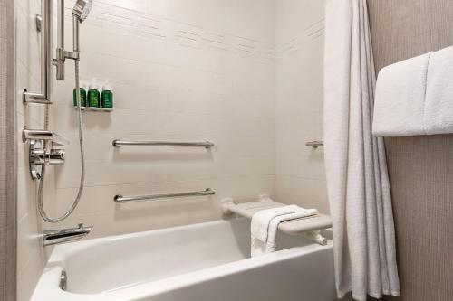 a white bathroom with a tub and a shower at Residence Inn by Marriott Philadelphia West Chester/Exton in Exton