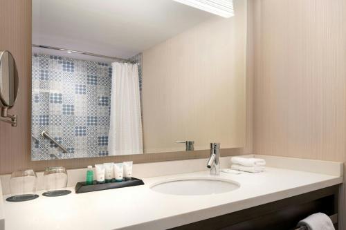 a bathroom with a sink and a mirror at The Westin Cleveland Downtown in Cleveland