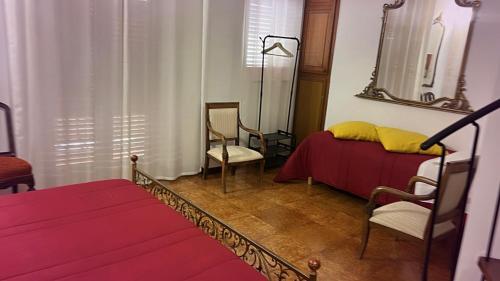 Postel nebo postele na pokoji v ubytování CASA DEL CORSO