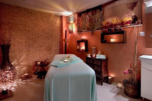 a room with a table in the middle of a room at Spa Hotel Rich in Velingrad