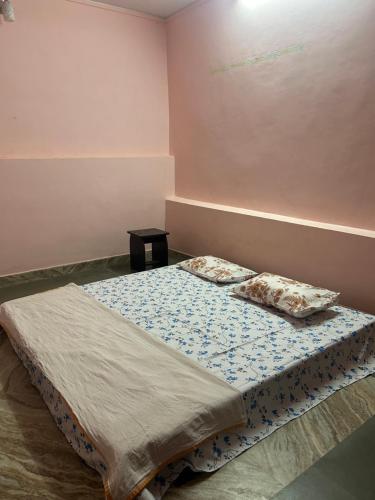 Postel nebo postele na pokoji v ubytování Sujata Homestay