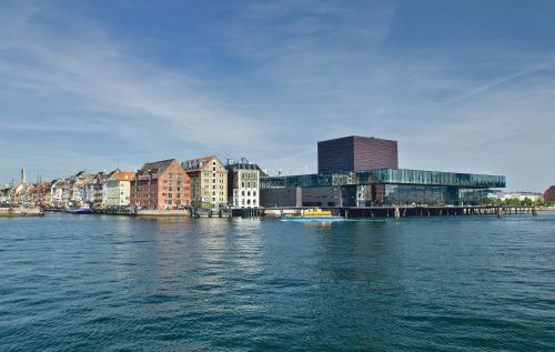a view of a city with buildings and water at 71 Nyhavn Hotel in Copenhagen
