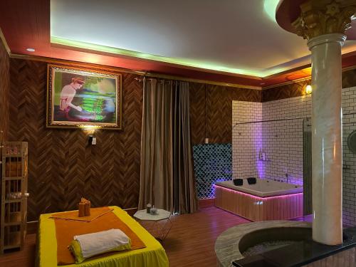 a bathroom with a bath tub and a tub at Hotel massage RiverSide in Ấp Buo18i Cán