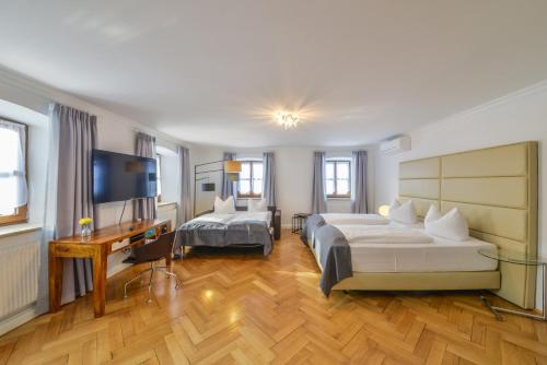 Postel nebo postele na pokoji v ubytování Hotel Wandinger Hof by Lehmann Hotels