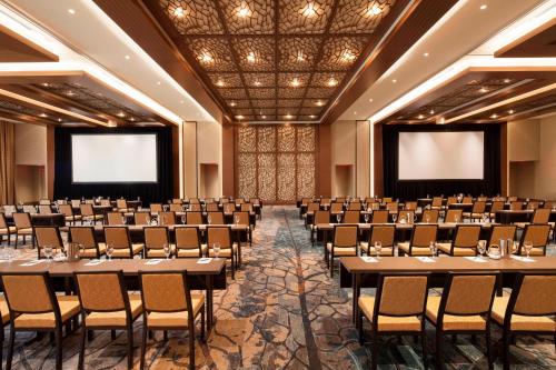 a conference room with tables and chairs and screens at The Westin Chattanooga in Chattanooga