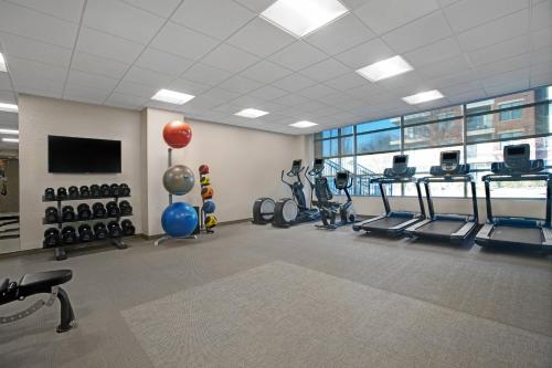a gym with several treadmills and machines in a room at SpringHill Suites by Marriott Franklin Cool Springs in Franklin