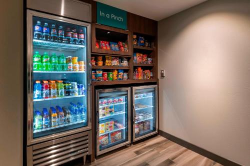 a refrigerator filled with lots of different types of drinks at TownePlace Suites by Marriott Leavenworth in Leavenworth