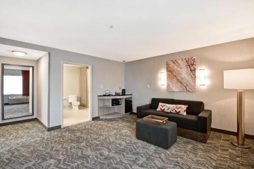 a living room with a couch and a table at SpringHill Suites by Marriott Indianapolis Airport/Plainfield in Plainfield