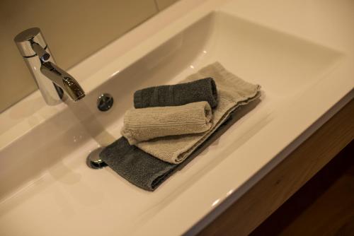 a white bath tub with two towels on it at Kendlhof in Sankt Johann im Pongau