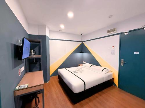 Postel nebo postele na pokoji v ubytování Smile Hotel Putrajaya