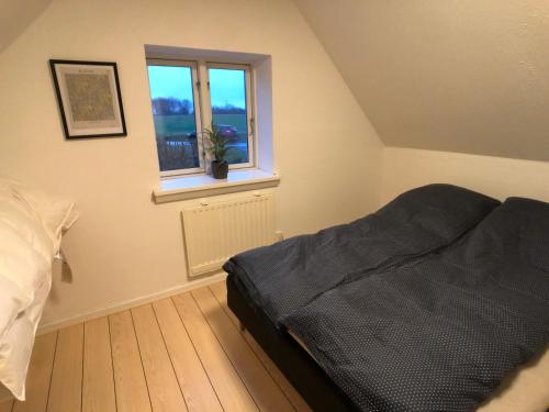 Postel nebo postele na pokoji v ubytování Kobbeldalhus
