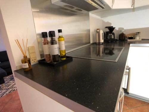 a kitchen with bottles of wine on a counter at Kobbeldalhus in Bredsten
