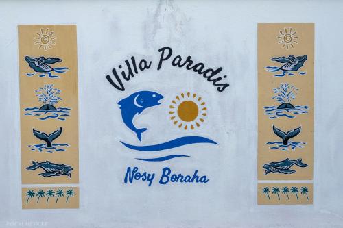 a white bag with the words wildlife paradise new barbados at Villa Paradis in Sainte Marie