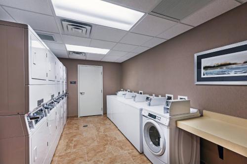 a laundry room with a washer and dryer at Residence Inn by Marriott Austin Northwest/The Domain Area in Austin