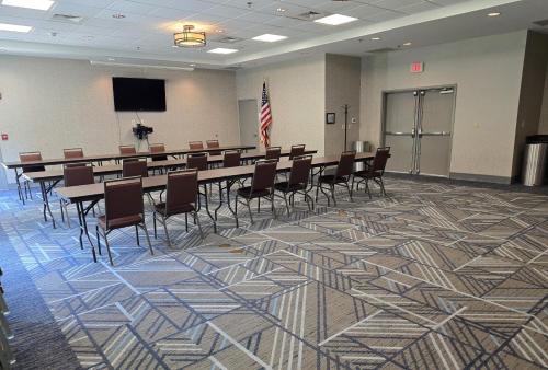 a conference room with a long table and chairs at Holiday Inn Express & Suites - Smithfield/Selma by IHG in Smithfield