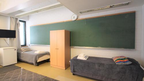 Ένα ή περισσότερα κρεβάτια σε δωμάτιο στο Forenom Hostel Espoo Otaniemi